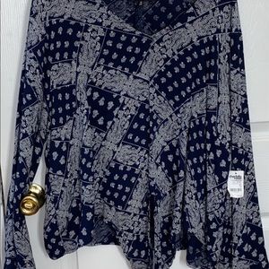 Blue blouse with design.